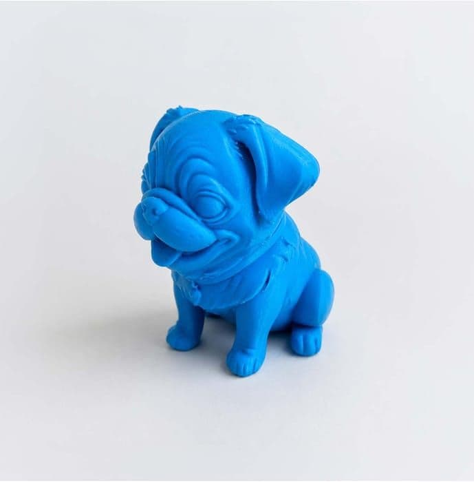 The blue 3D printed Pug figurine from a three-quarter angle